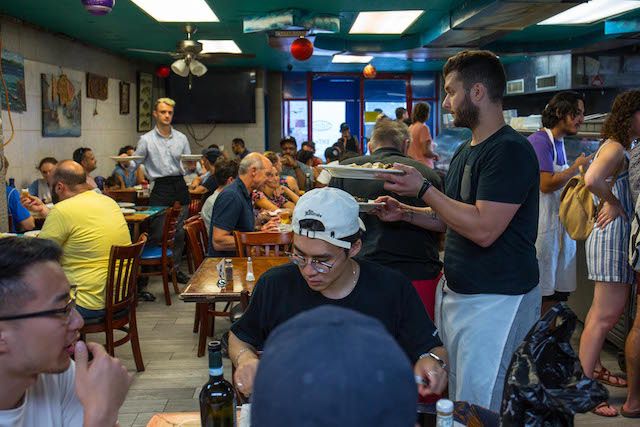 People dine inside Astoria Seafood